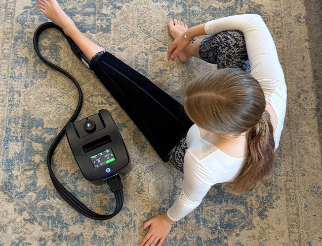 Cryon-X machine connected to a leg wrap during a seated treatment at home