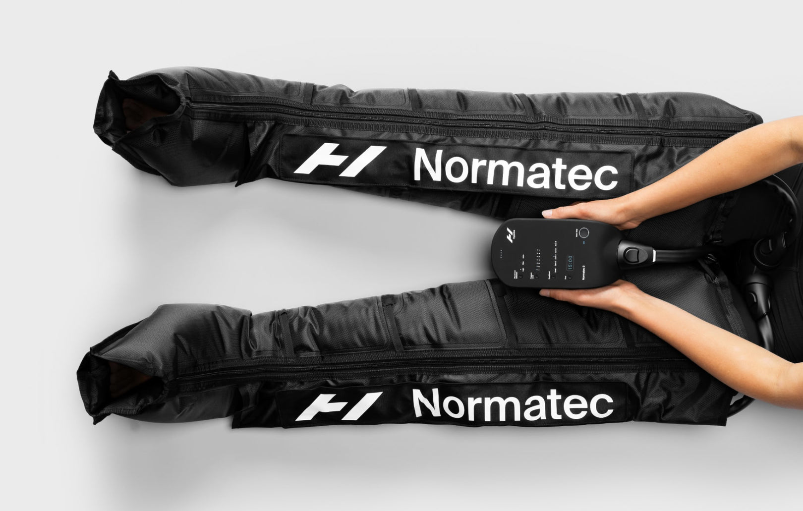 Normatec leg compression boots in use while resting at home